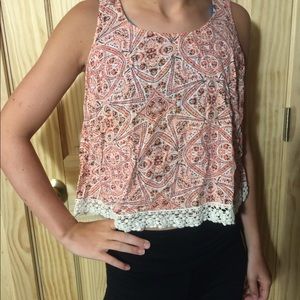 Orangy colored designs tank